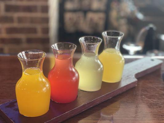 Mimosa flight! Mango, strawberry, pineapple, and orange!