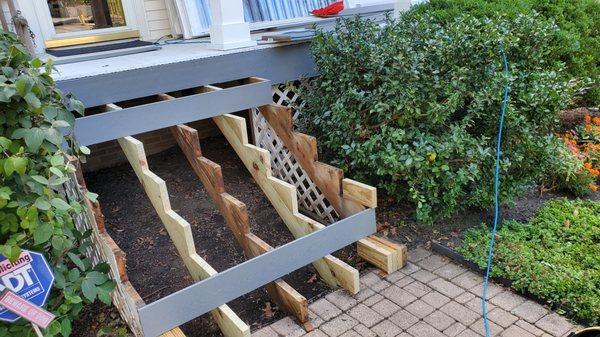 Added additional supports to the stair system prior to installing new composite deck boards in Mount Prospect,IL