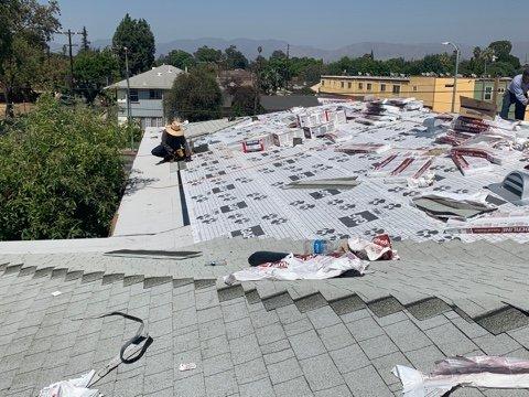 Installing first layer of torch down followed by GAF shingles and underlayment