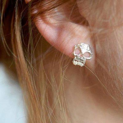 Hand-hewn silver skull stud - his snaggly teeth are made from antique rescued seed pearls. Created for us by the awesome golden groove.