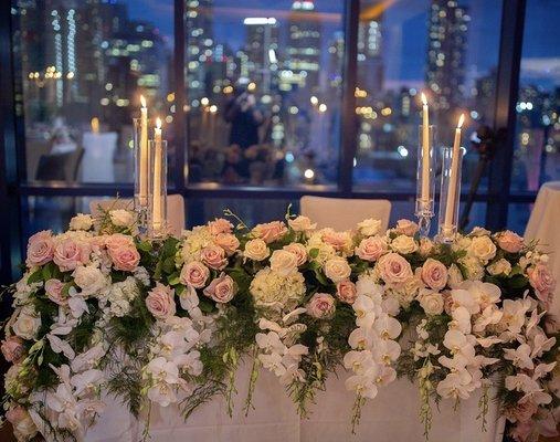 Sweetheart table for the bride and groom with impeccable views