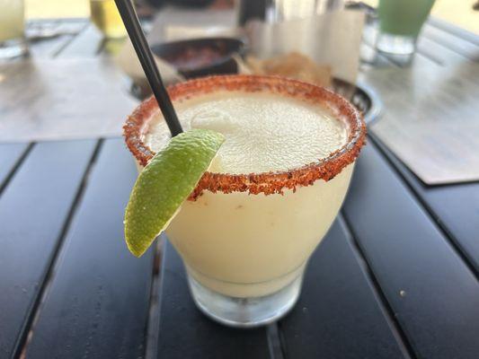 Seasonal Frozen Margarita (Pineapple Coconut with Tajín Rim)