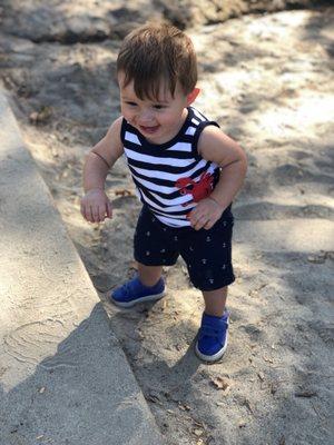 Happy playing in the sand area.