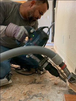 Our dust free tile removal expert sucking the dust at the source!