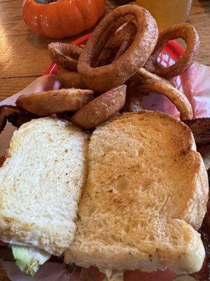 Turkey BLT with onion rings.