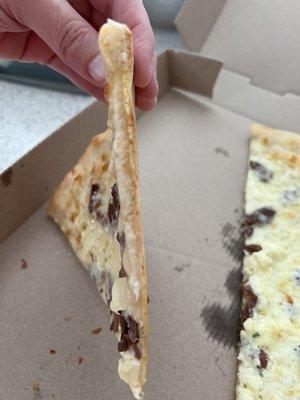 Cardboard. Their crust was never like this and its not supposed to be a thin crust. No taste either.