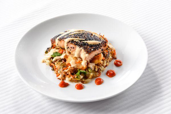 Sesame crusted Faroe Island salmon, fried rice, peppers, onions, carrots, peas, served with house made kimchi and spicy lime crema