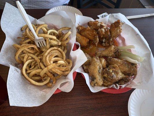 Honey lemon pepper wings. Hot with minced garlic.  Curly Frys.