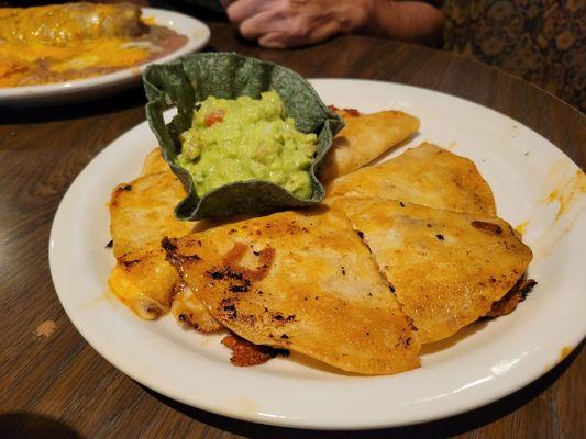 Shredded beef quesadilla with guacamole.