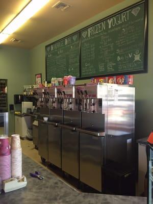 Front of house with me u and frozen yogurt on tap.