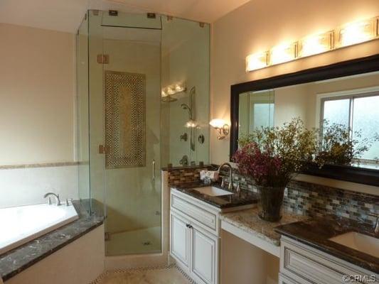 Newly remodeled bathroom. Notice the beautiful cabinets in Antique White? It has a gorgeous rope design.