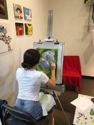 Student working with pastels