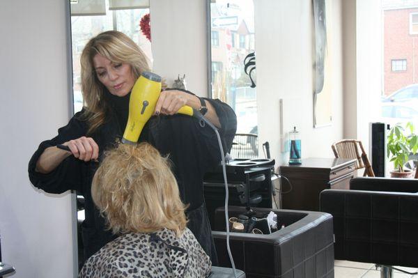 The owner of Symmetry Salon, Alice Pires, is in the process of creating another gorgeous style.