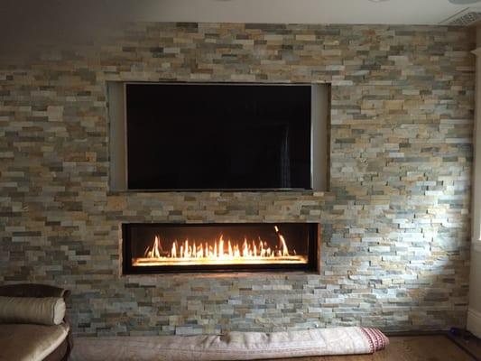 Linear Fireplace with TV above.