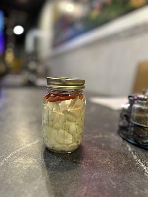 Pickled sliced garlic and chili peppers