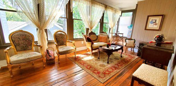 The Sewing Room is a delightful sitting room  with ceiling fan where you can enjoy a cup of coffee or soda and curl up with a good book.