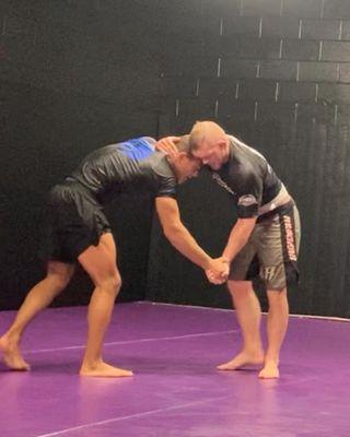 Beginner and advanced students training standing grappling tactics in 8pm Monday night competition class.