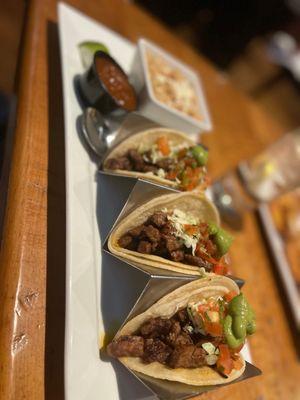 Steak tacos with a side of beans