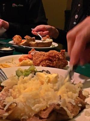 Buffet offerings... Potatoes, Fried Chicken, Green Beans, Roasted Root Veggies, Salad Bar, Tortellini, Tilapia, etc.