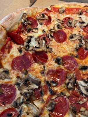 Medium pepperoni mushroom pizza