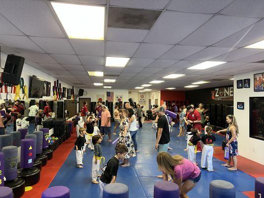 Parents learning karate with their kids!