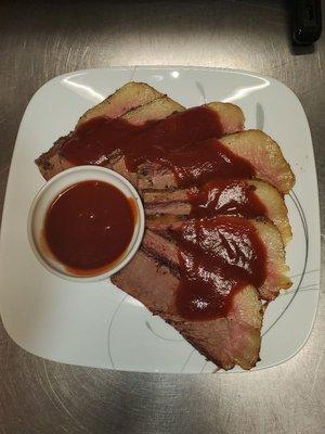 Beef Brisket Dinner topped with Tipsy Q Signature BBQ Sauce. Served with your choice of our Downhome Alabama Sides.