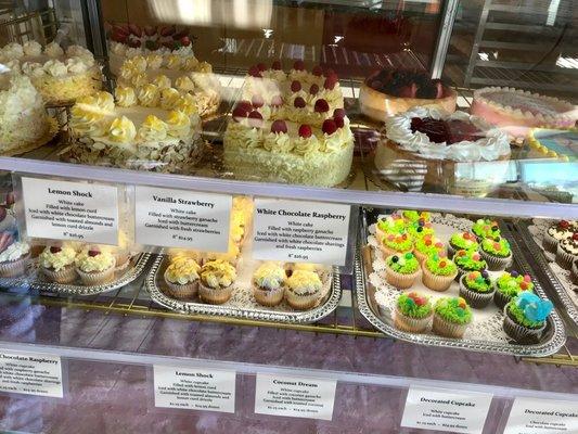 Examples of their selection of cupcakes and cakes.