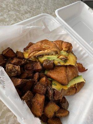 The snooze button breakfast sandwich on a croissant