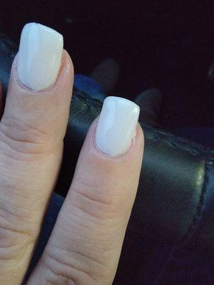 Chip in the tip of one finger, uneven cuticles.