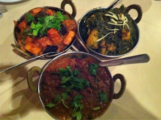 Baigan Paneer (eggplant with homemade cheese); Aloo Gobi Saag (potato, cauliflower, and spinach); and daal (lentils)