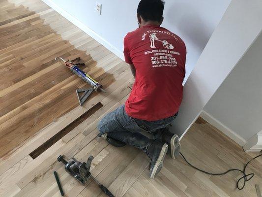 Repairing hardwood floors.