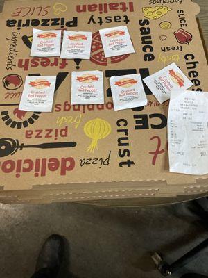 7 packs of crushed pepper and 3 pizzas worth 30 bucks