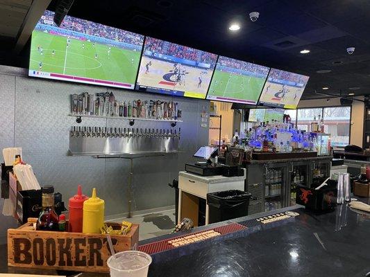 Seat from the bar with beer taps, spirits with an appearance from the condiment box.