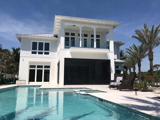 Phantom Motorized Screens installed in the patio openings of this beautiful Boca Raton home.