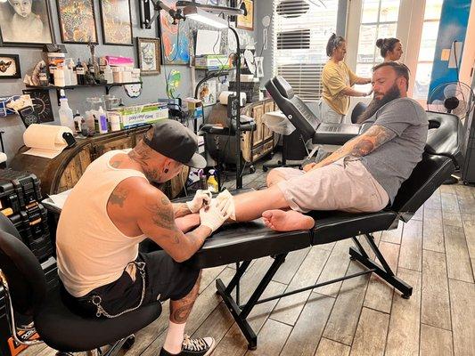 Husband getting tatted.