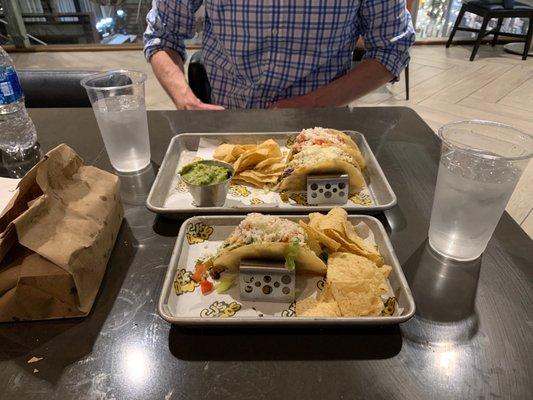 Side order of chips and guacamole. CJ's Original is closest and Holy Potato and Korean BBQ Pork in the far tray.