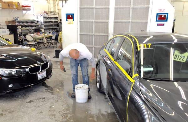 Carlos prepping before these beauties get into our state of the art spray booth.