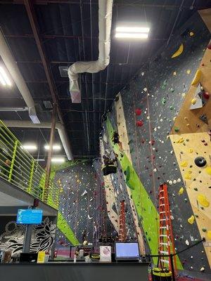 Staff resetting the Southwest climbing wall on a Monday.