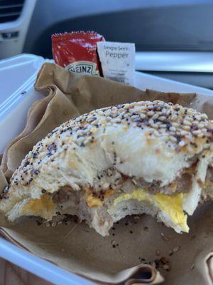 Sausage, egg and cheese on a everything bagel w/ketchup and pepper