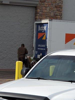 UPS delivering packages to Walmart in Budget Truck