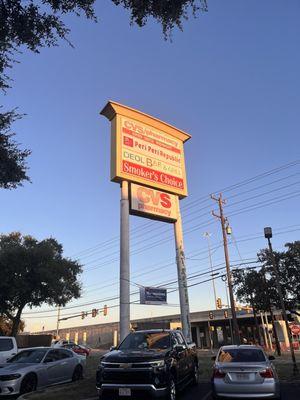 Sign for the restaurant off of 1604