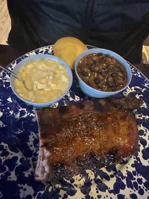 Half rack of ribs, creamed corn, baked beans