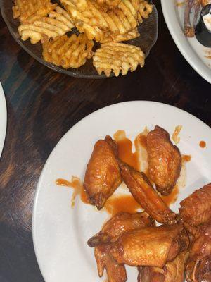 Buffalo wings and waffle fries