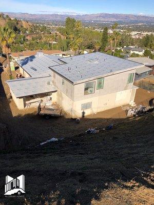 Metal Roofs: Our team of techs removed the old shingles and covered it with a membrane before the metal roof was added