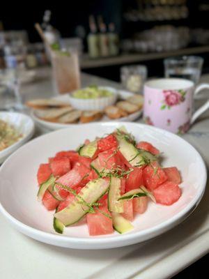 Cucumber watermelon salad made with cucumber ribbons & watermelon chunks topped with fresh basil, mint, & a light citrus vinaigrette.