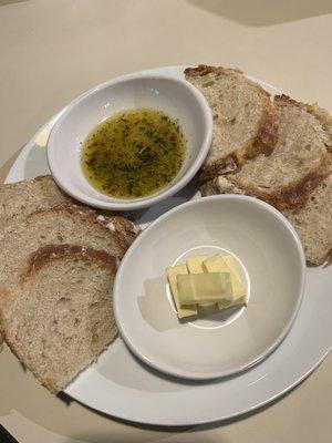 Fresh Sourdough bread with oil to dip and butter