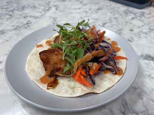 Crispy Pork Belly Taco's Soy glaze, grilled flour tortilla, Asian slaw, chipotle & tahini drizzle