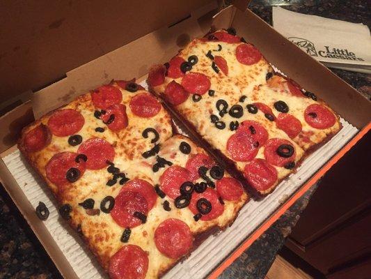 Deep Dish pizza order w/ pepperoni, black olives, and extra cheese.