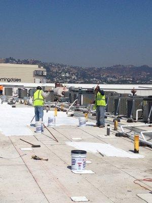 GAF elastomeric white roofing coating on hi-rise apartment building in downtown LA.