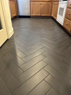 Herringbone tile floors.